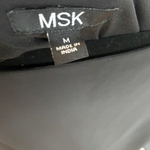 Medium black dress with attached sheer scarf